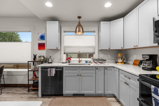 1010 7th St E Unit A, Whitefish, MT 59937 - kitchen featuring dishwashing machine, a sink, recessed lighting, light countertops, and light wood-style floors