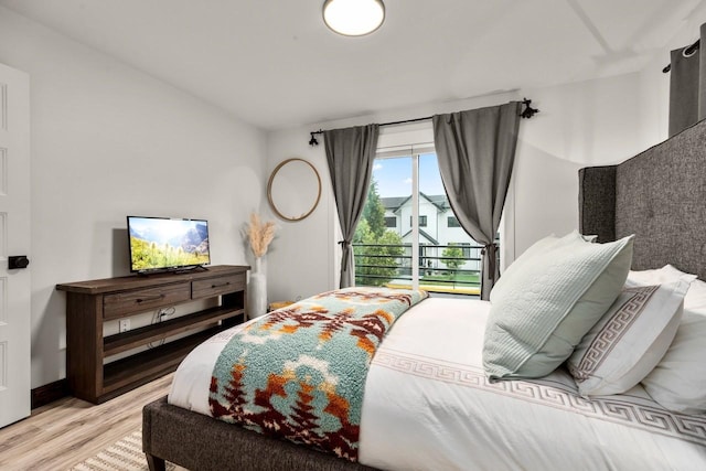 1010 7th St E Unit A, Whitefish, MT 59937 - bedroom featuring wood finished floors and access to exterior