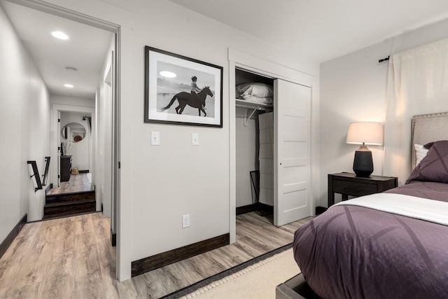 1010 7th St E Unit A, Whitefish, MT 59937 - bedroom featuring light wood-style flooring, a closet, baseboards, and recessed lighting