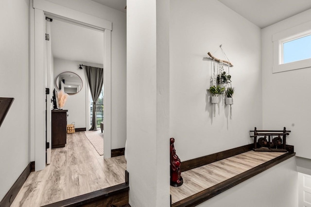 1010 7th St E Unit A, Whitefish, MT 59937 - corridor featuring wood finished floors and baseboards