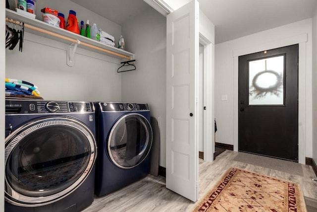 1010 7th St E Unit A, Whitefish, MT 59937 - laundry area with washer and clothes dryer and light wood finished floors