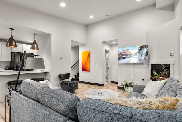 1010 7th St E Unit A, Whitefish, MT 59937 - living area featuring recessed lighting, light wood-style floors, stairway, and baseboards