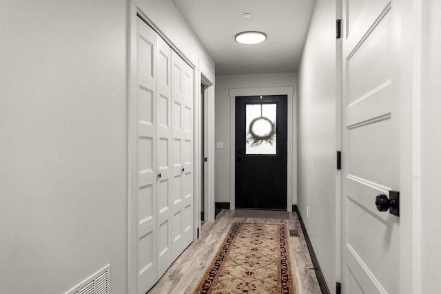 1010 7th St E Unit A, Whitefish, MT 59937 - doorway featuring light wood finished floors and baseboards