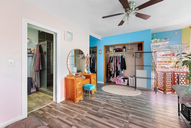 bedroom with wood-type flooring and ceiling fan