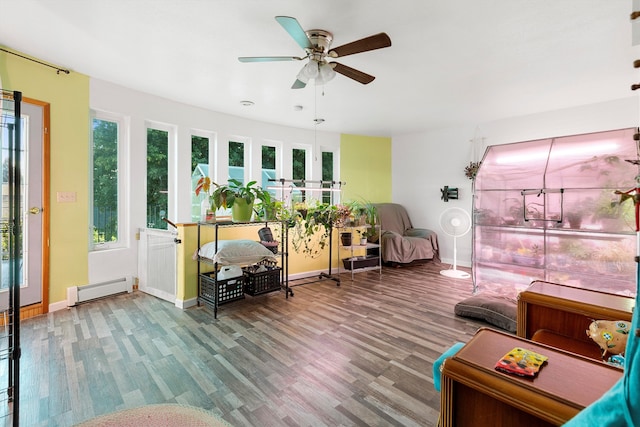 interior space featuring a baseboard radiator, ceiling fan, and hardwood / wood-style flooring