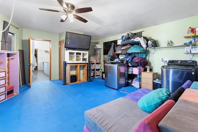 interior space with washer / dryer and ceiling fan