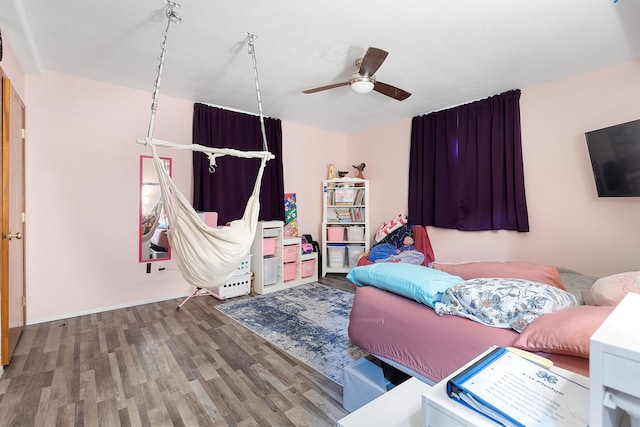 interior space with ceiling fan and hardwood / wood-style floors