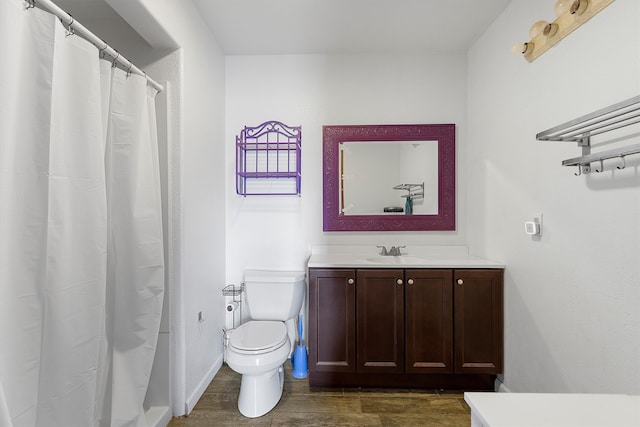 bathroom with vanity, hardwood / wood-style floors, toilet, and a shower with shower curtain