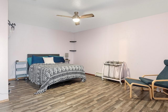 bedroom featuring hardwood / wood-style floors and ceiling fan