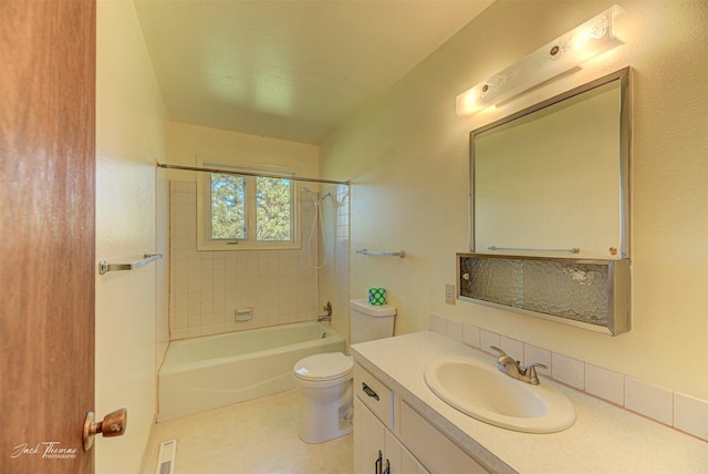 bathroom featuring toilet, vanity, visible vents, and shower / bathing tub combination