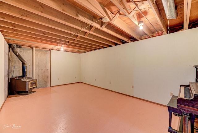 below grade area featuring a wood stove