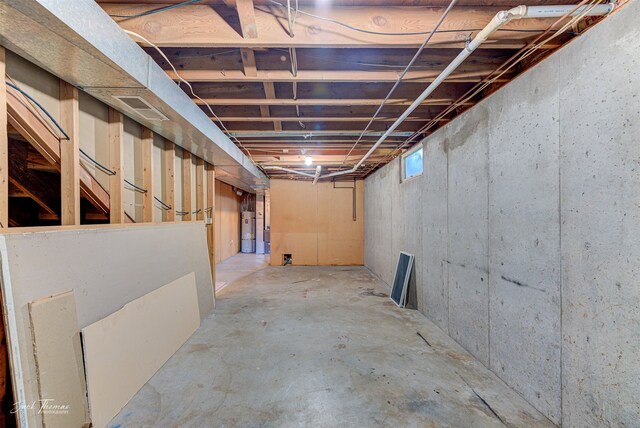 basement featuring strapped water heater