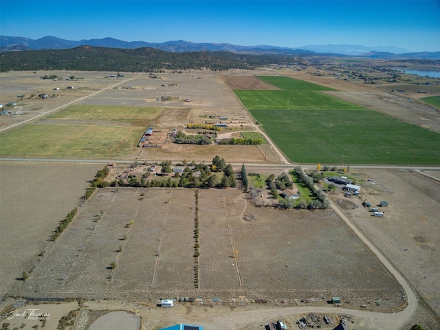bird's eye view with a mountain view and a rural view