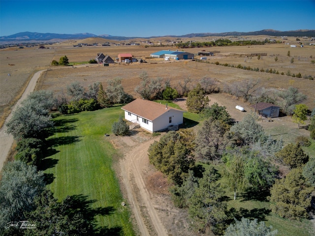 bird's eye view featuring a rural view and a mountain view