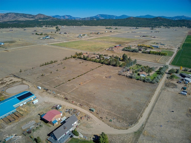 aerial view featuring a rural view and a mountain view