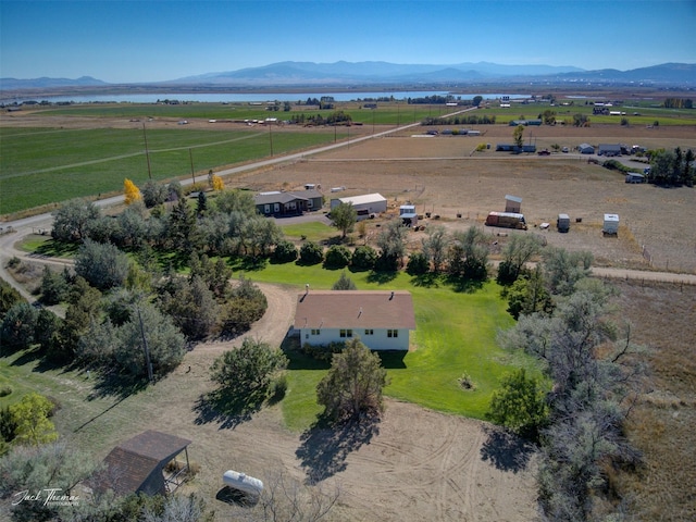 birds eye view of property featuring a rural view and a water and mountain view