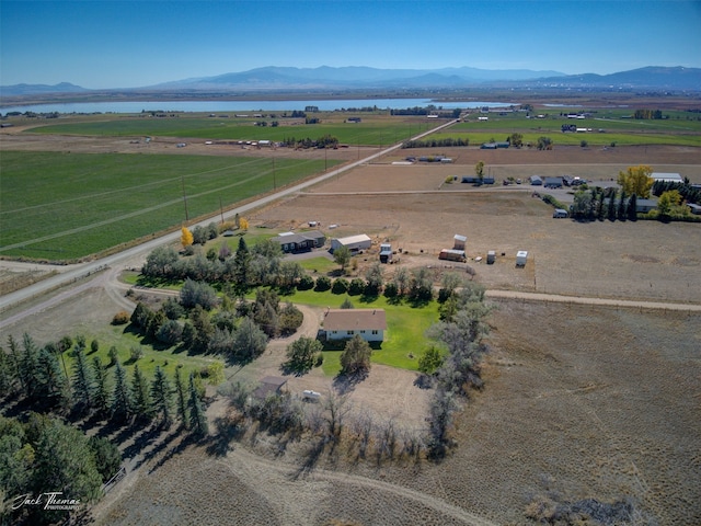 drone / aerial view with a mountain view and a rural view