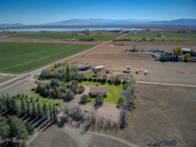 birds eye view of property with a rural view and a water and mountain view