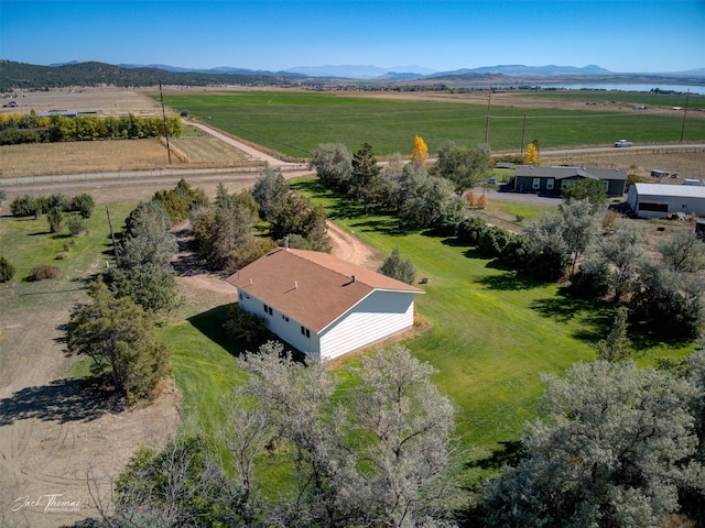 birds eye view of property featuring a mountain view and a rural view