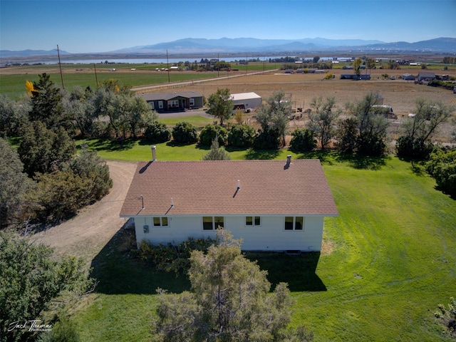 bird's eye view featuring a rural view and a mountain view