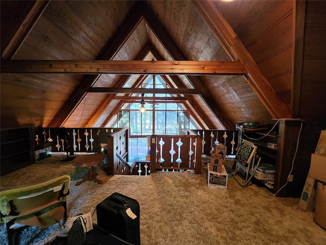 interior space with ceiling fan, wood ceiling, and lofted ceiling with beams