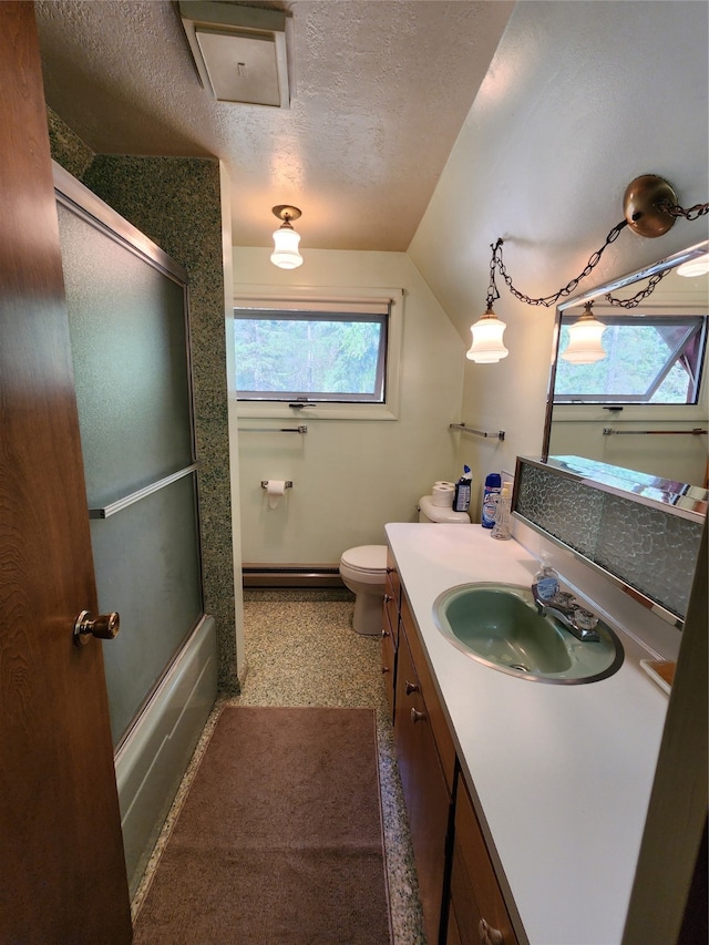 bathroom with lofted ceiling, vanity, toilet, and plenty of natural light