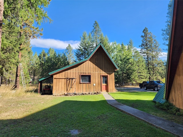 view of outdoor structure with a yard