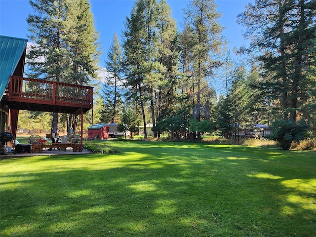 view of yard with a wooden deck