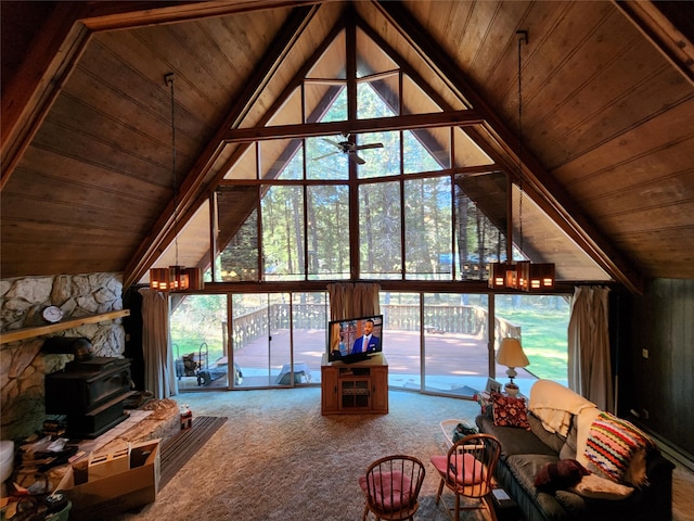 unfurnished living room with a chandelier, a wood stove, vaulted ceiling, carpet floors, and wooden ceiling