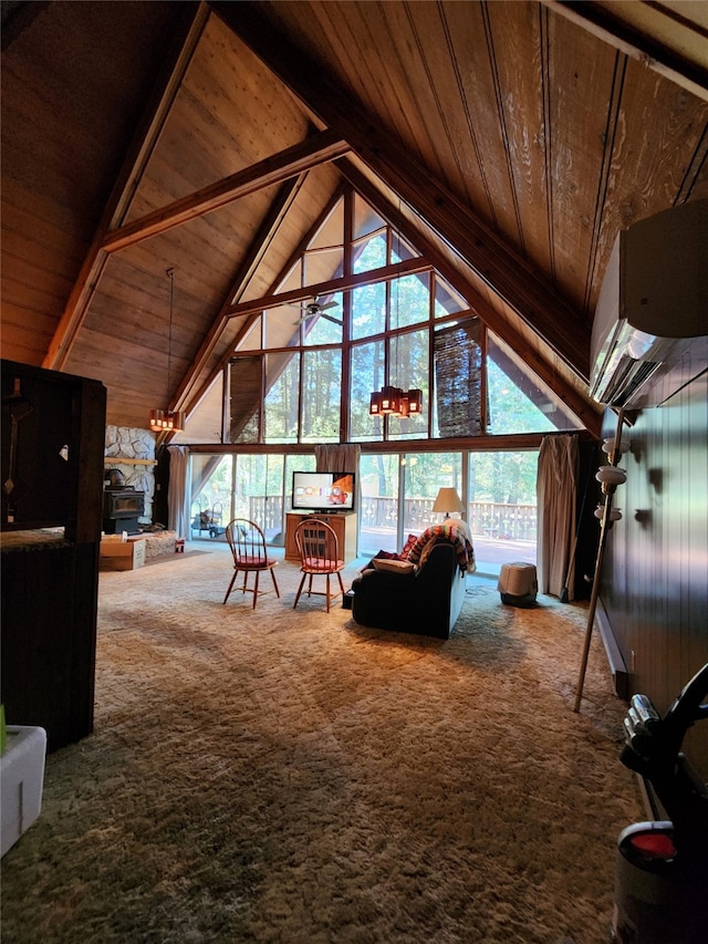 unfurnished living room with beamed ceiling, wooden ceiling, carpet, and a healthy amount of sunlight