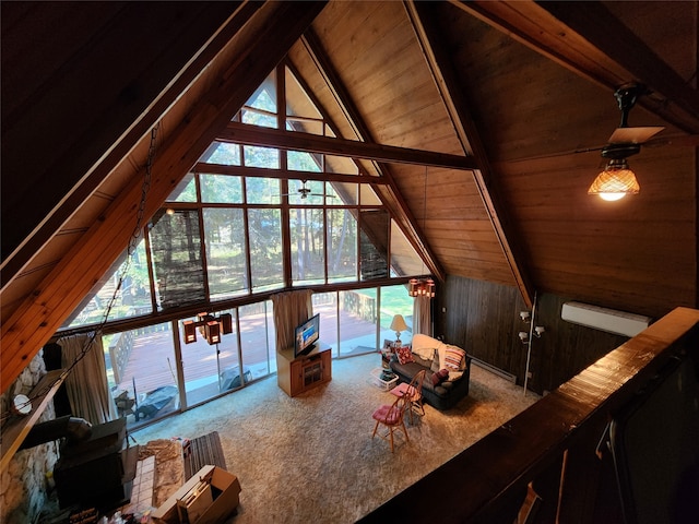 unfurnished living room featuring vaulted ceiling with beams, wood walls, wooden ceiling, and a healthy amount of sunlight