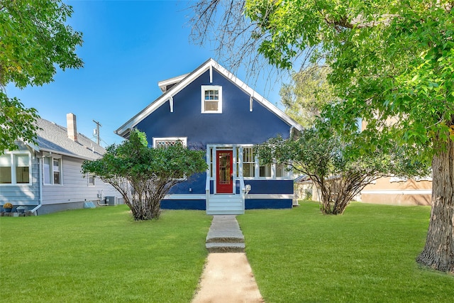 bungalow-style house with a front yard