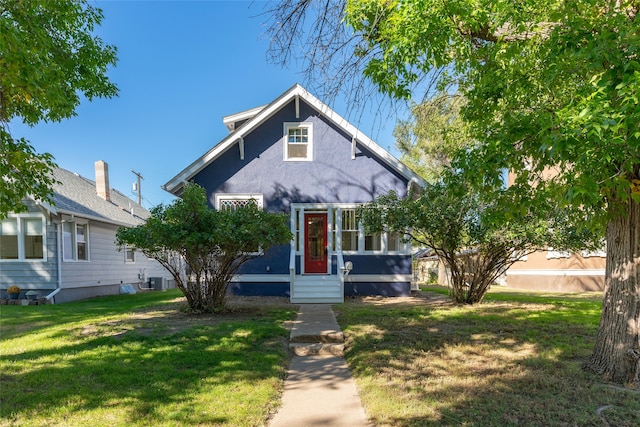 bungalow-style home featuring a front yard