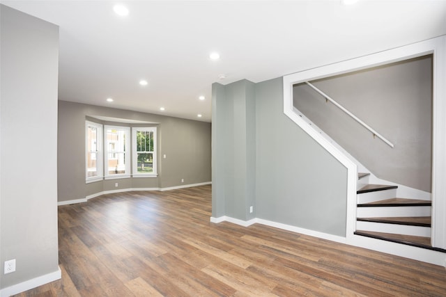 614 3rd Ave, Havre, MT 59501 - unfurnished room with wood finished floors, recessed lighting, and stairway