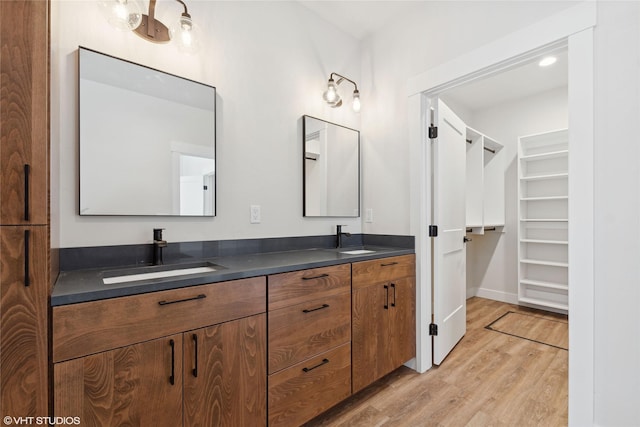 bathroom featuring vanity and wood-type flooring