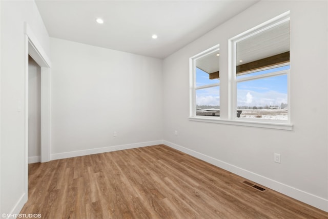 unfurnished bedroom with hardwood / wood-style floors