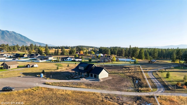 drone / aerial view featuring a mountain view