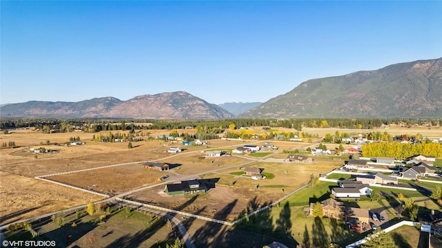 birds eye view of property with a mountain view