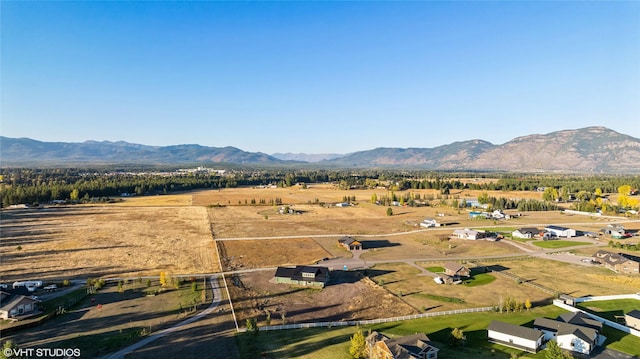 birds eye view of property with a mountain view