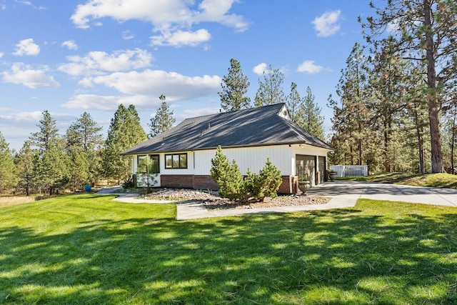 view of side of home featuring a yard