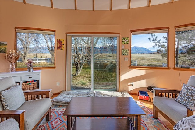 sunroom featuring a mountain view