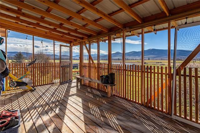 sunroom / solarium featuring a mountain view