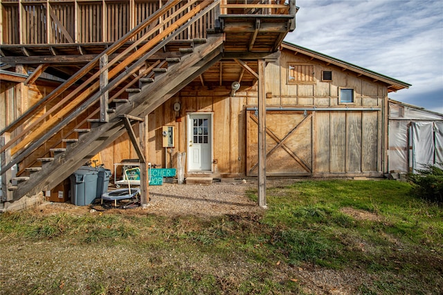 back of property with an outbuilding