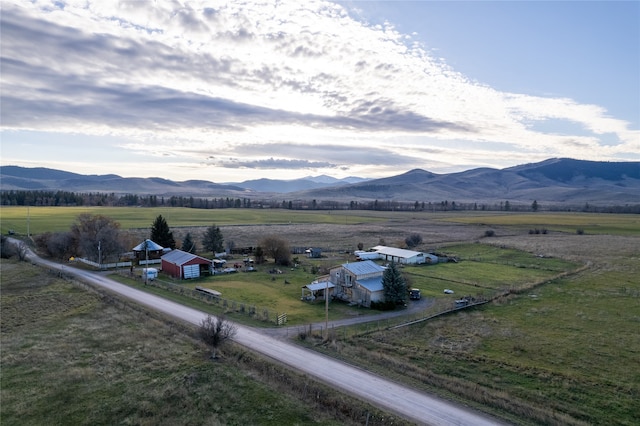 drone / aerial view featuring a rural view and a mountain view