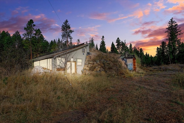 view of property exterior at dusk