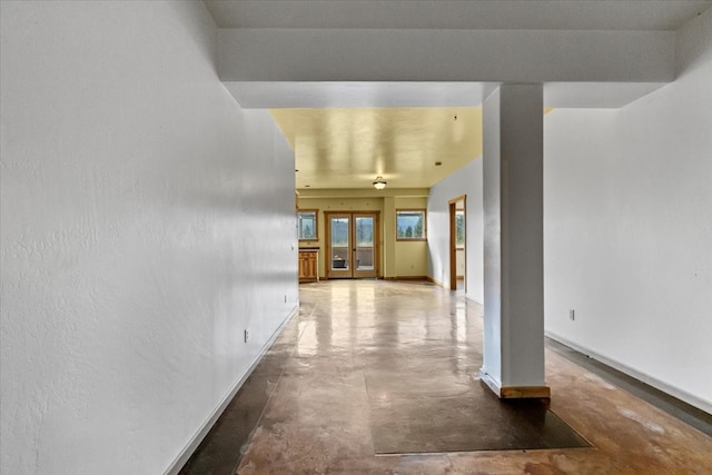 hallway with concrete floors