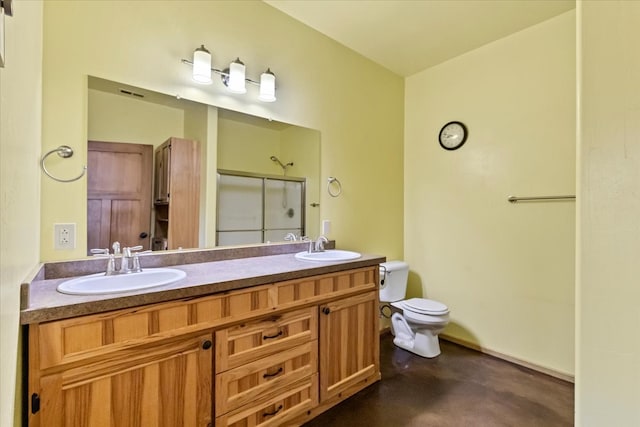 bathroom featuring vanity, toilet, an enclosed shower, and concrete floors