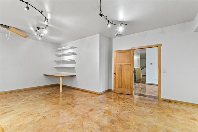 169 Brookes Dr, Rexford, MT 59930 - unfurnished room featuring track lighting and concrete flooring
