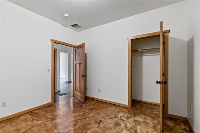 unfurnished bedroom with a closet