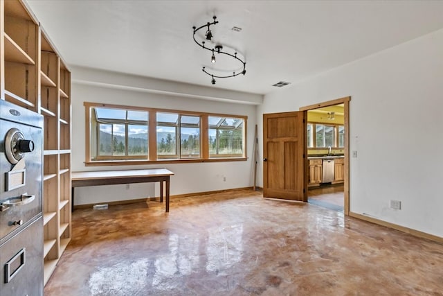 interior space with sink and concrete floors